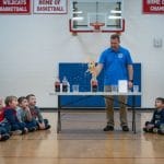 School science assembly with curious students