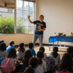 Students watching energetic school assembly in gym