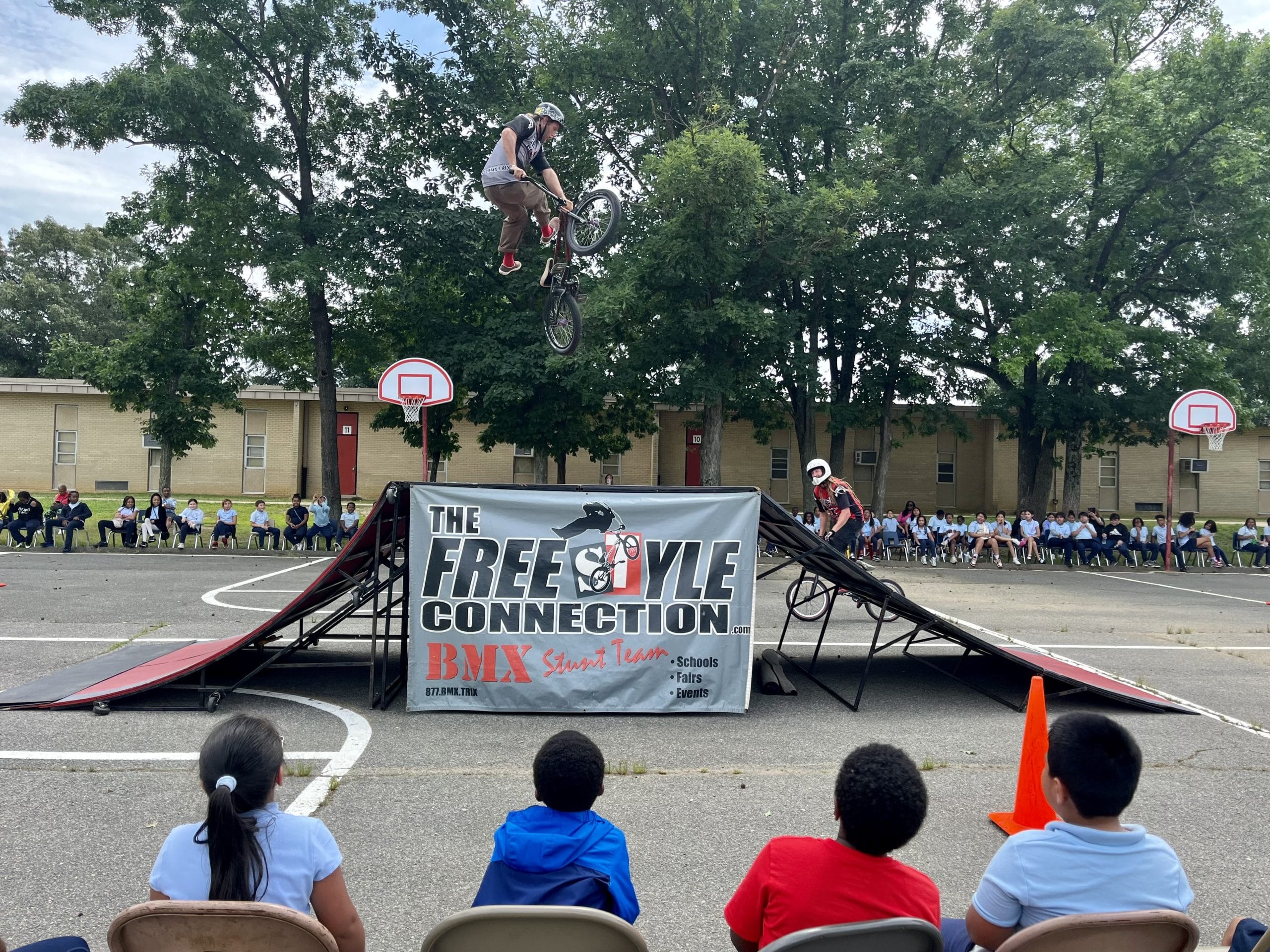 community enjoying an assembly outdoors