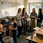 Teachers and students tidy up after appreciation event