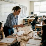 Teacher guiding STEAM project in classroom
